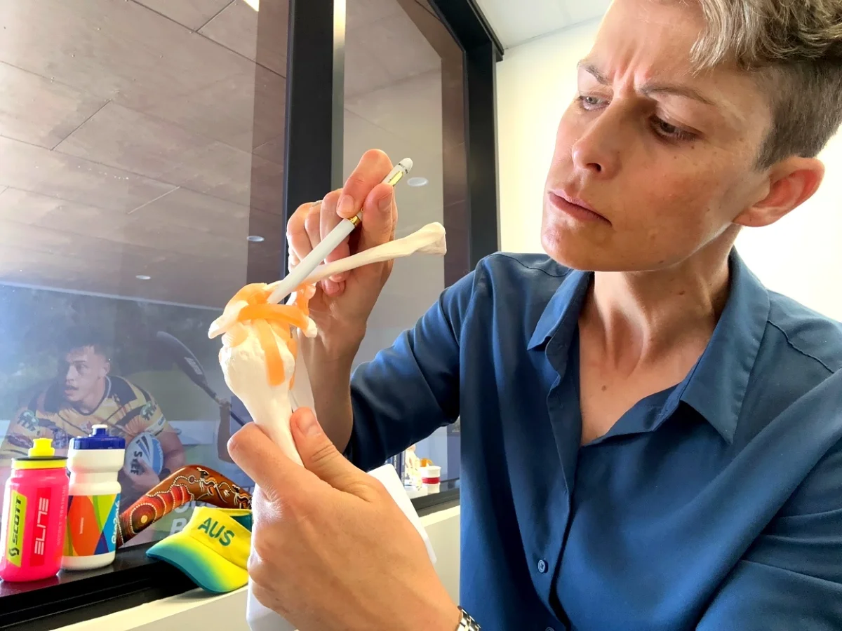 Dr Wells explaining shoulder anatomy to patient